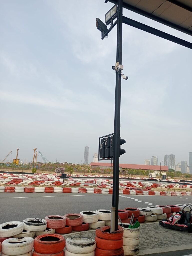 Outdoor camera installation beside an open track area